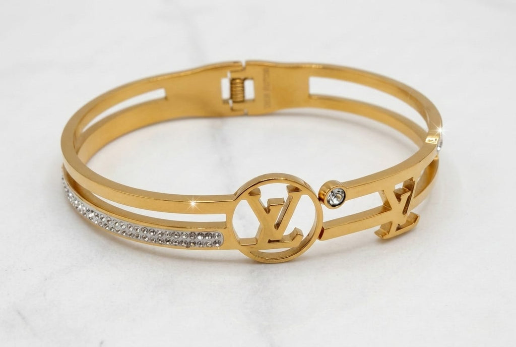 LOUIS VUITTON (LV) HAND CUFF, GOLD PLATED WITH AMERICAN DIAMOND