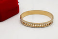HAND CUFF, GOLD PLATED WITH AMERICAN DIAMONDS